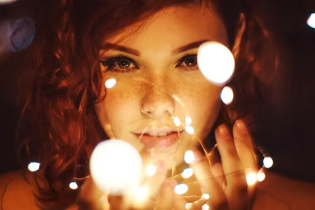 photography of a woman holding lights 799420