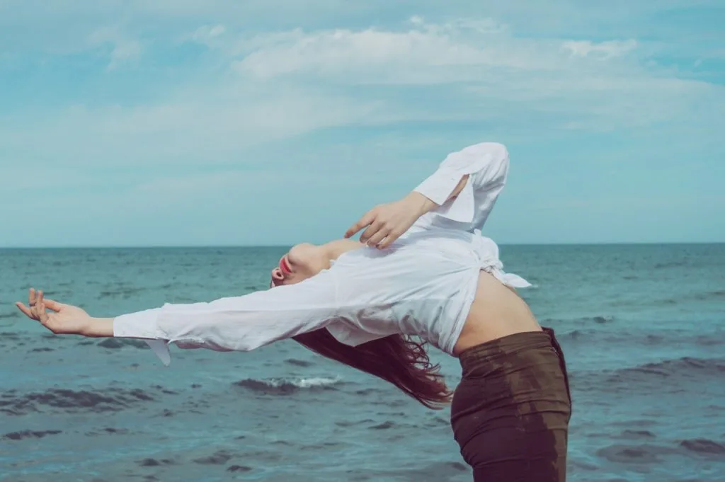 woman leaning backward near body of water 3049223 scaled