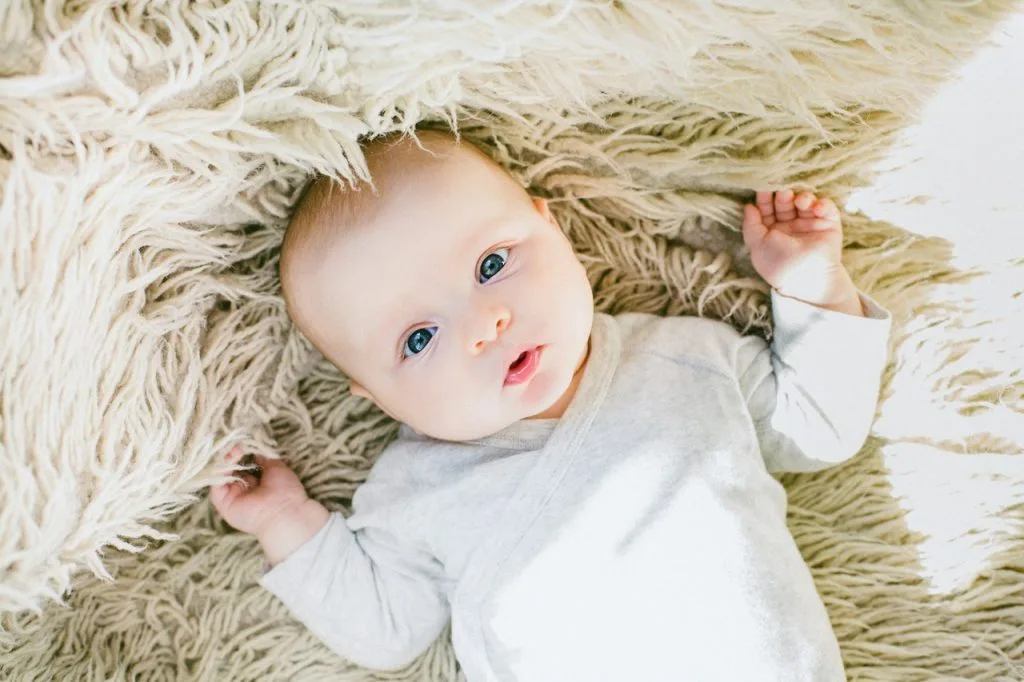 baby in white onesie 789786 scaled